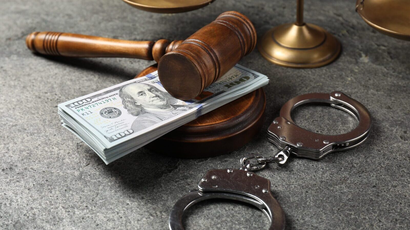 gavel money handcuffs