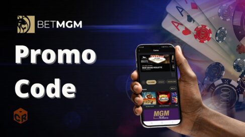 BetMGM Promo Code written across a casino montage background of chips, cards, and dice, with a hand holding a smartphone showing the BetMGM app.